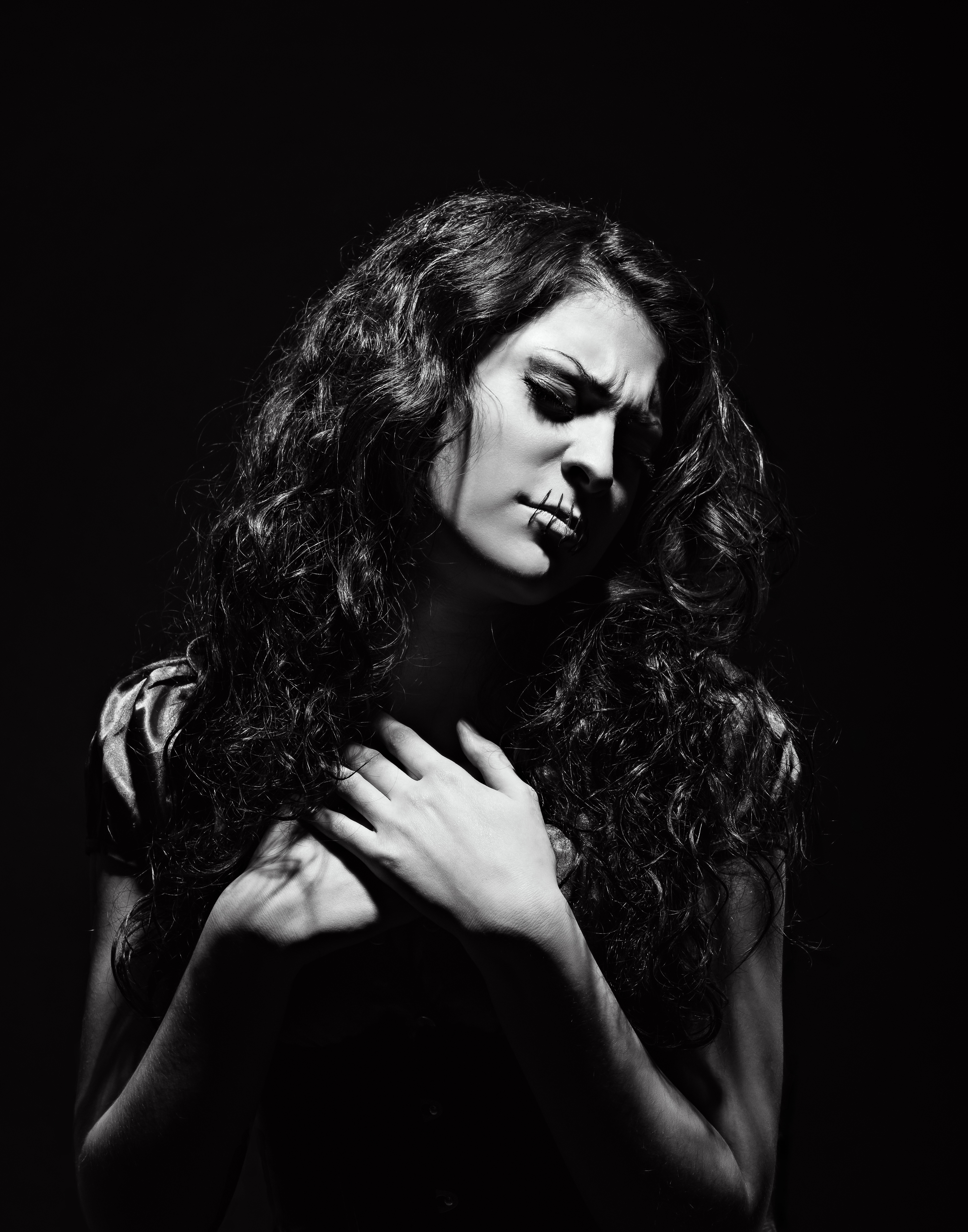 Silenced, mouth sewn shut, victim