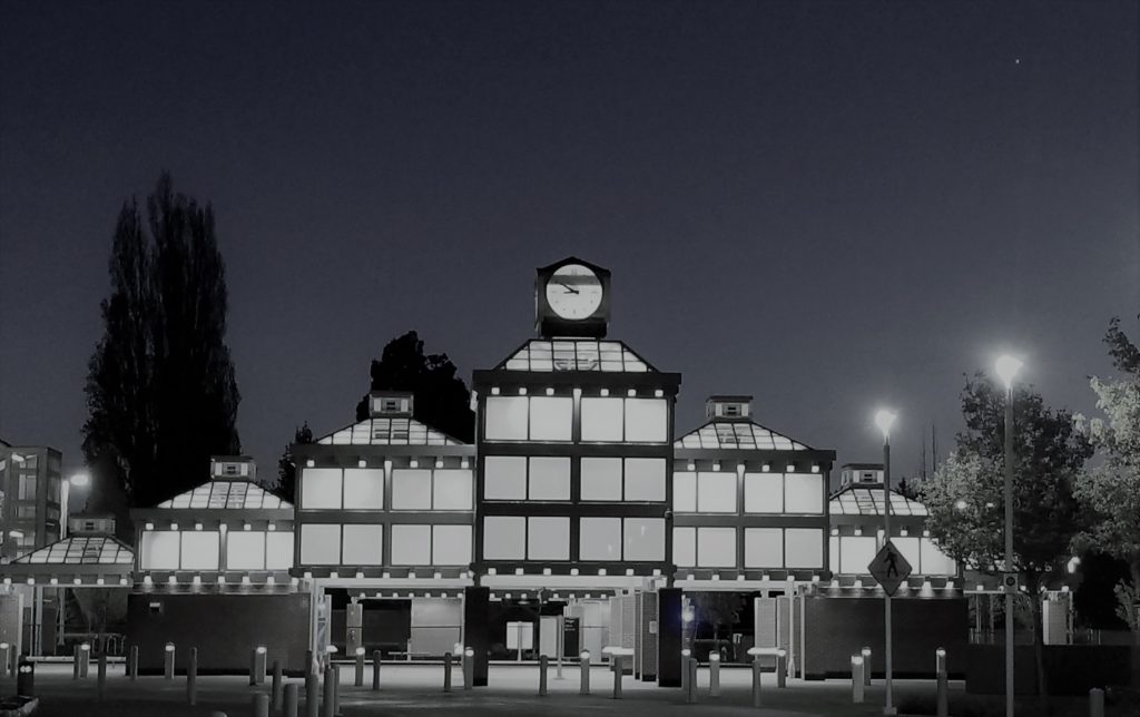 A black and white photo of the Auburn Transit Center looking straight on.