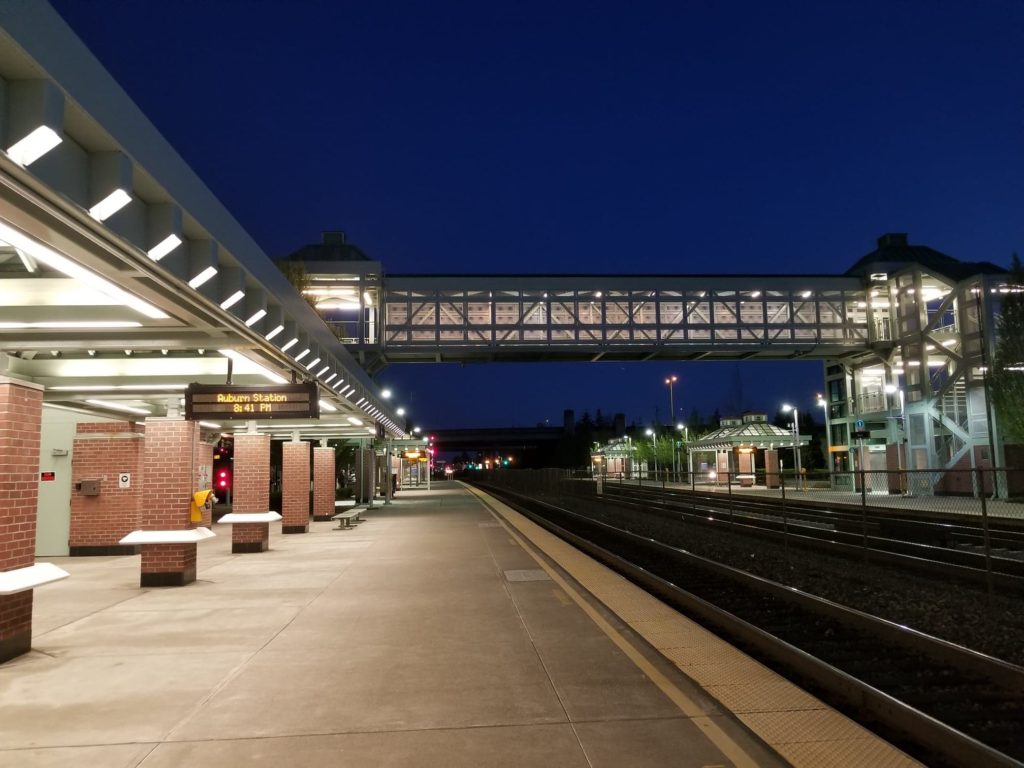 Looking south down the platform at the Auburn transit center at night