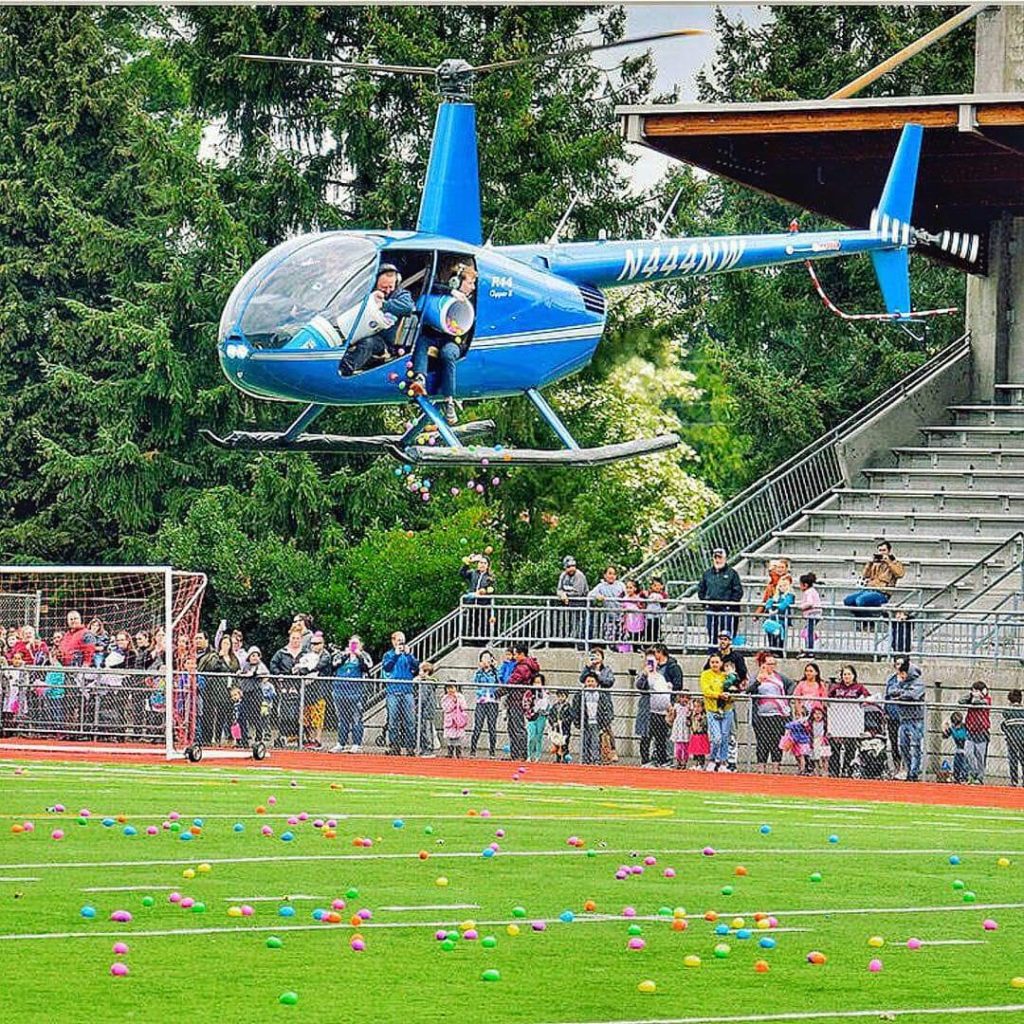 the hop, REVIVE Auburn, easter egg hunt, easter eggs from a helicopter, easter bunny, awesome inc, bounce house, community, community event, auburn memorial stadium,