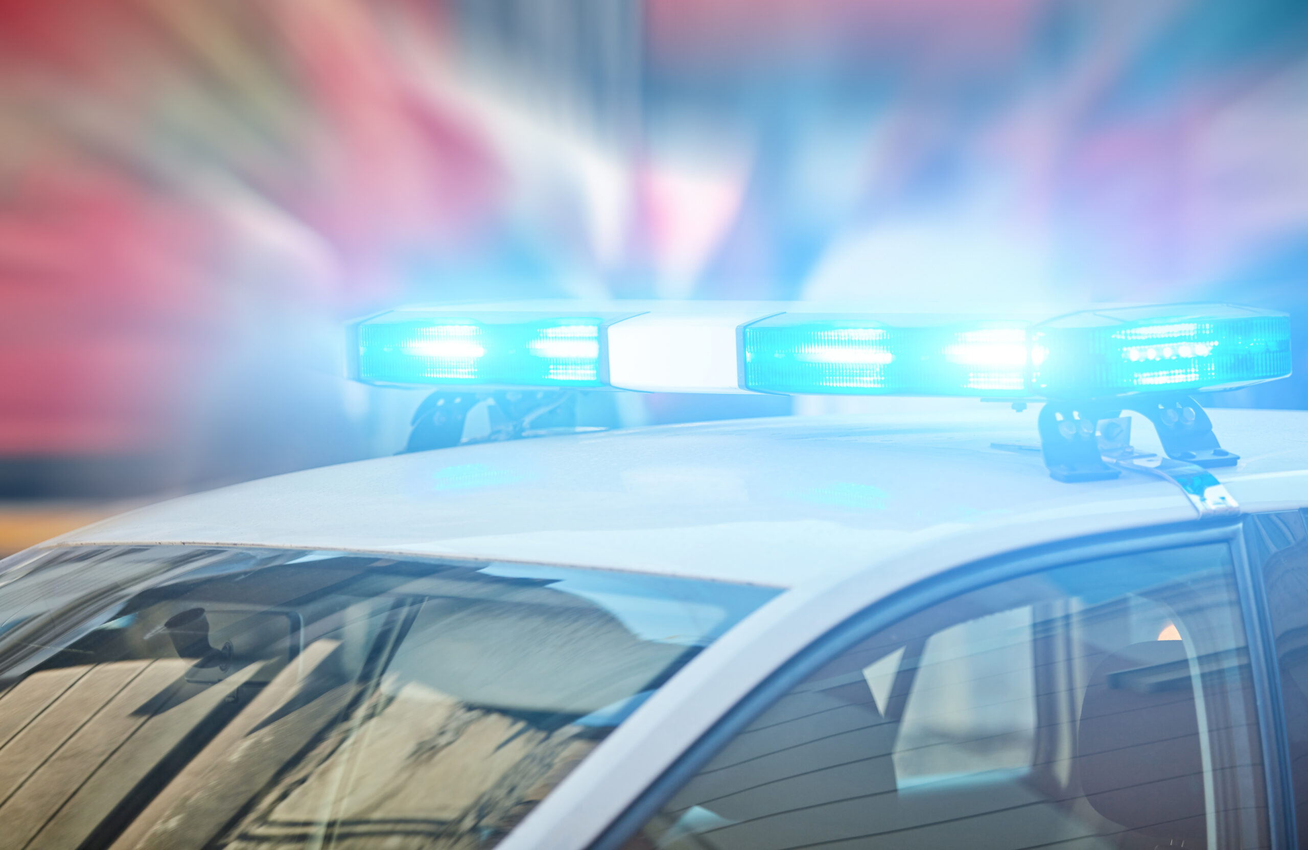 The top of a police unit, the blue lights lit up
