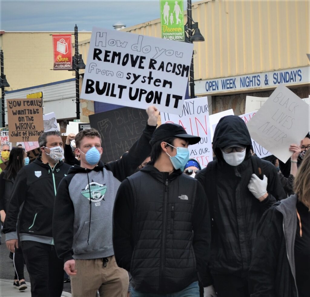 A protester holds a sign during the June 2 BLM protest | photo by Amy Thompson