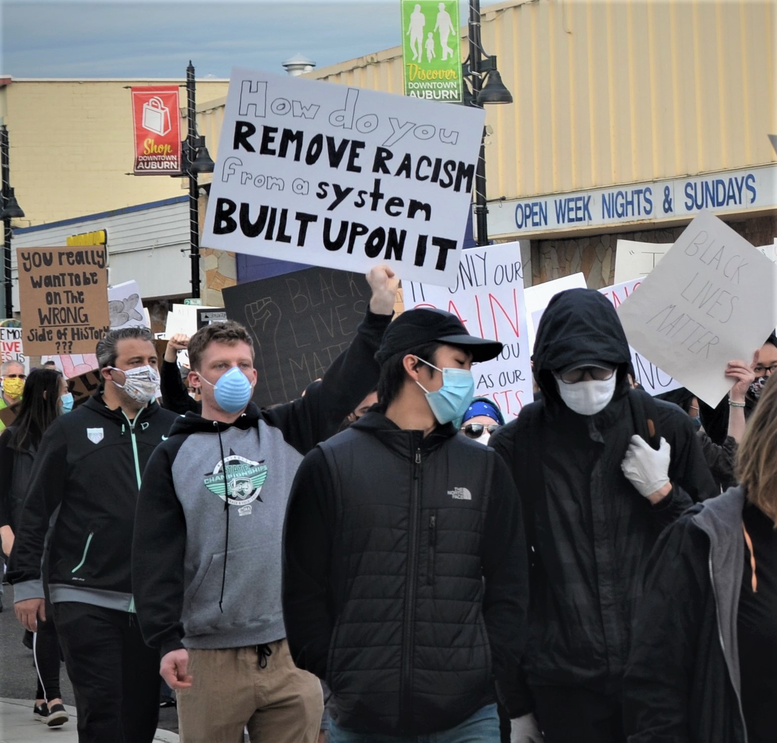A protester holds a sign during the June 2 BLM protest | photo by Amy Thompson