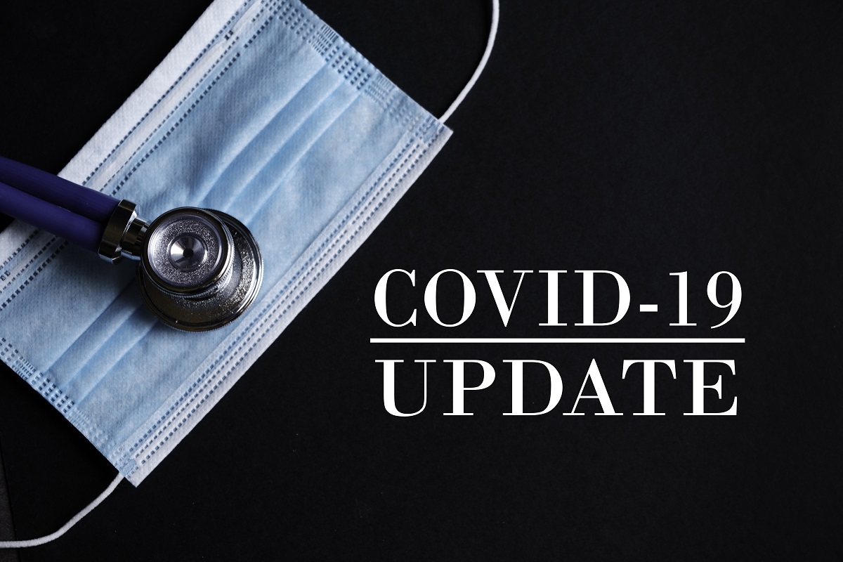 A blue surgical mask and stethiscope on a black background with the words "COVID-19 Update" under them