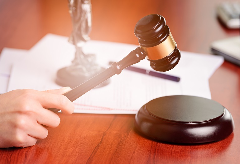 Woman holding judge gavel