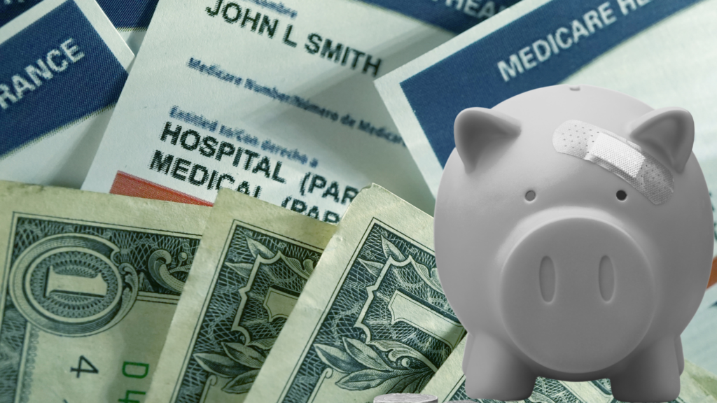 A pale, ounded piggy bank with a bandaid over its eye sits before a backdrop of a pile of dollar bills and Medicare cards.