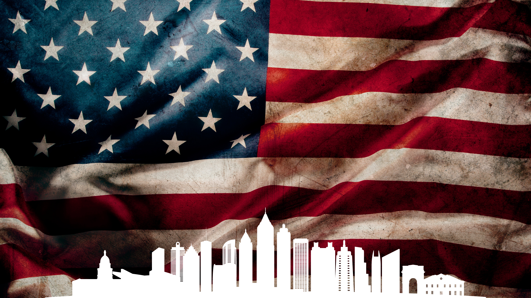 An American flag with a white Atlanta skyline outline at the bottom