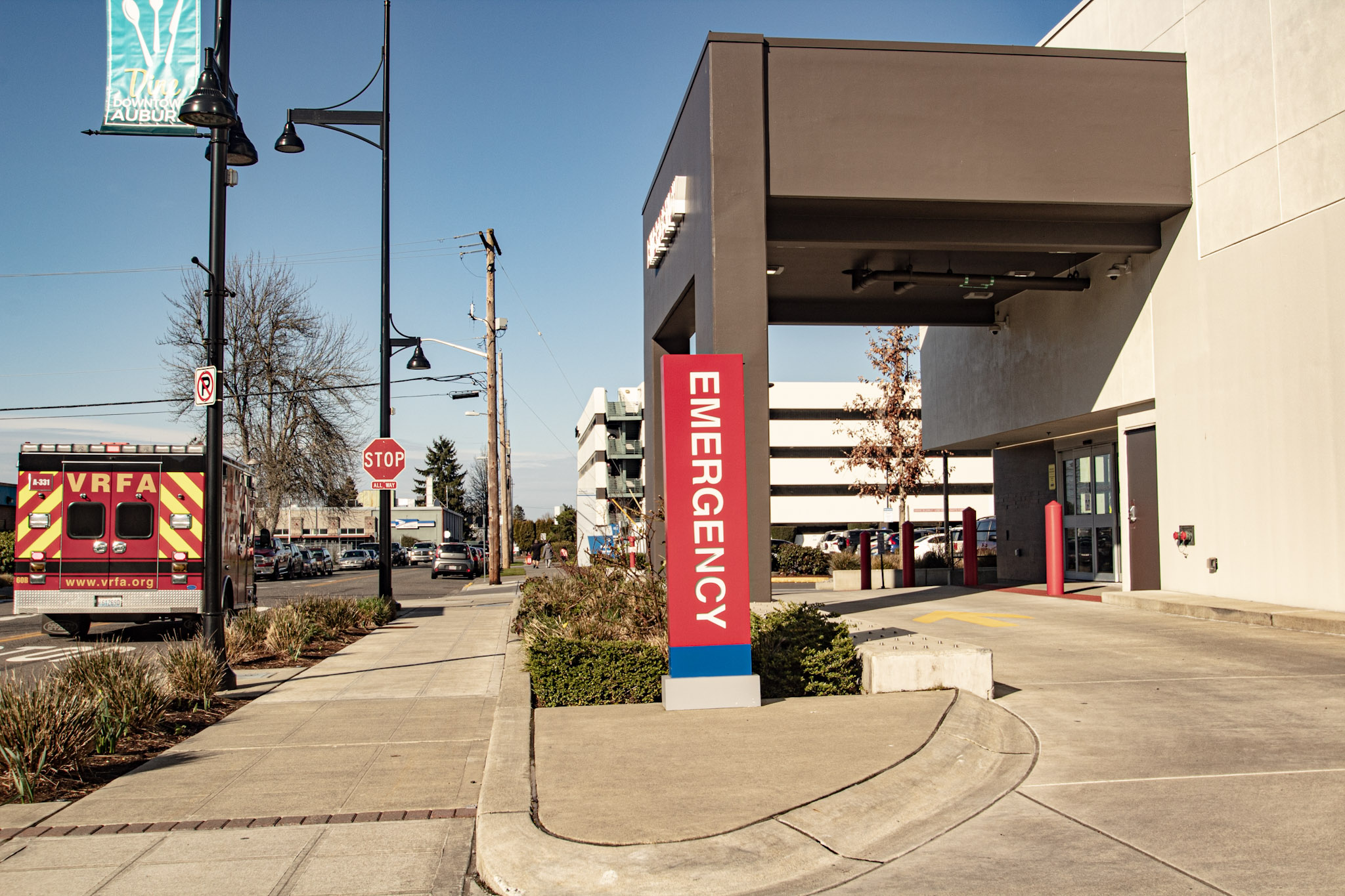 A VRFA aid car is stopped in the street in front of the MultiCare Auburn Medical Center Emergency entrance breezeway