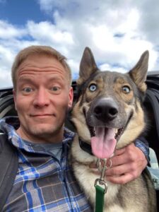 Joey, an white adult male, and Max, a German Shepherd mix dog