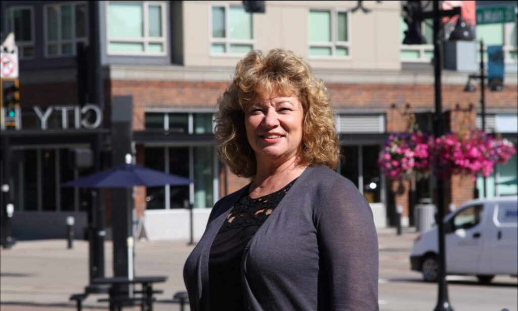 Auburn Mayor Nancy Backus stands in downtown Auburn on a sunny day