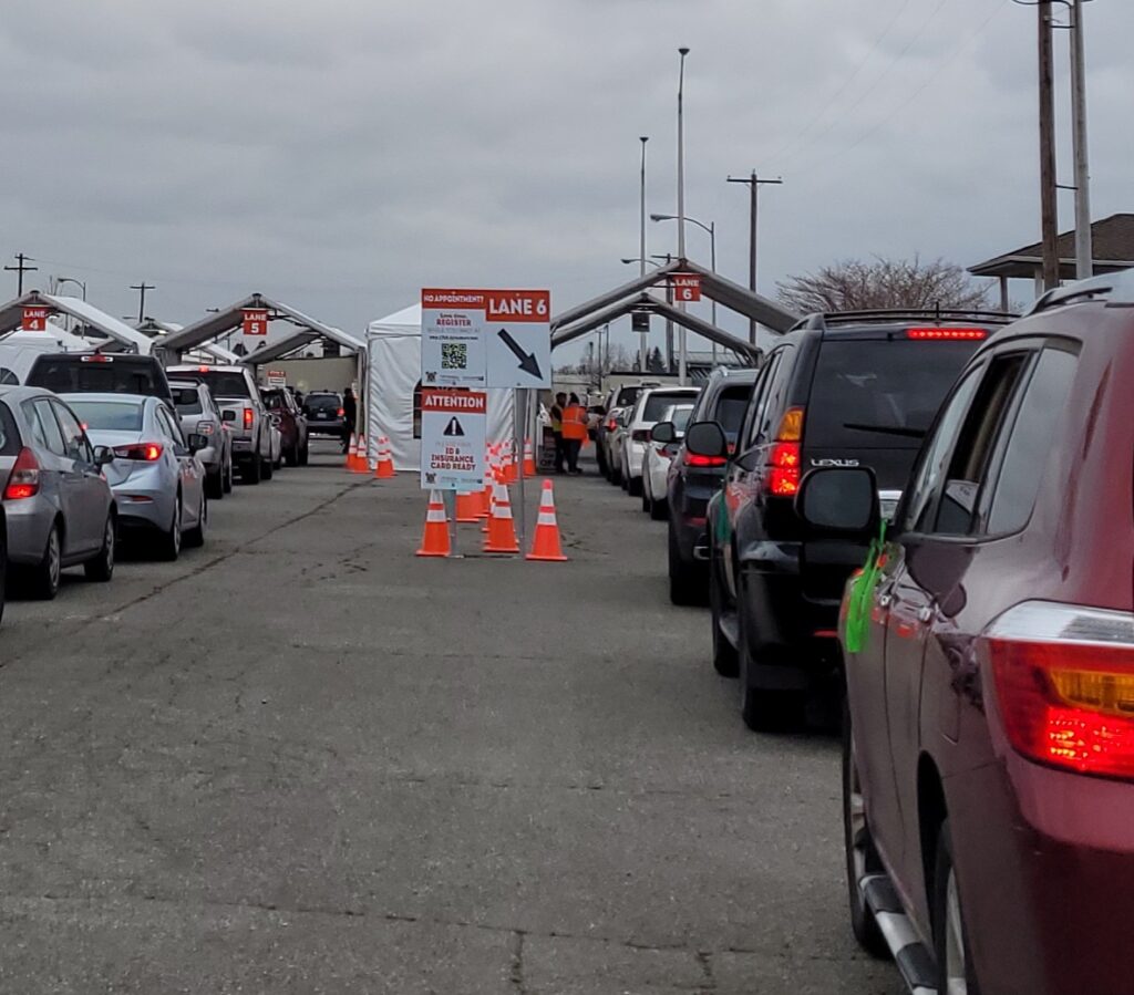 A line of vehicles wait at the King county COVID-19 Vaccine site in Auburn. 