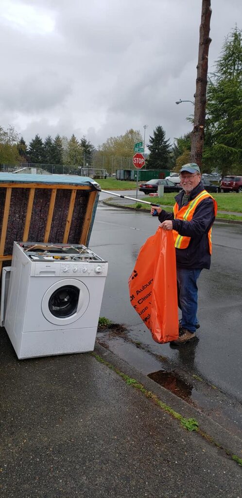 Kiwanis Club of Auburn pose after working during Auburn's Clean Sweep 2021