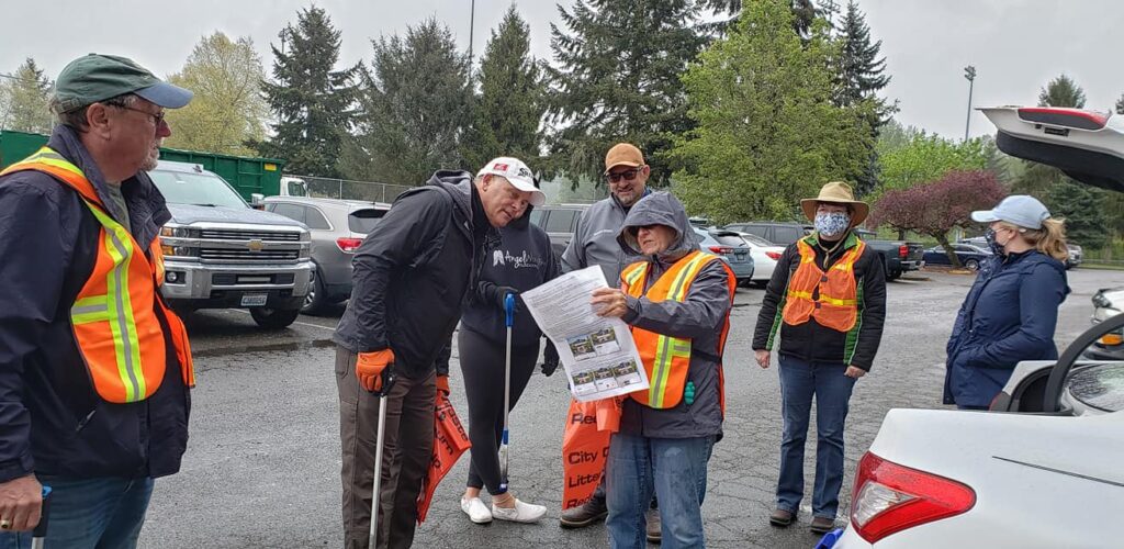 Kiwanis Club of Auburn receive direction during Auburn's Clean Sweep 2021