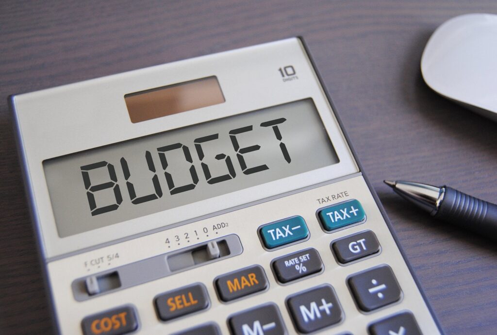 the word BUDGET is digitally written on a calculator