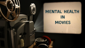 a reel to reel film projector plays on a screen, the words "Mental Health in Movies" on the screen