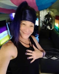 Saint smiles brightly at the camera