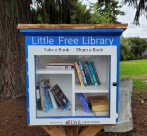 a close up of the DAR little library in Indian Tom park