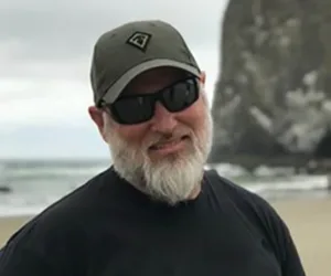 A photo of Clark County Deputy Jeremy Brown on a beach