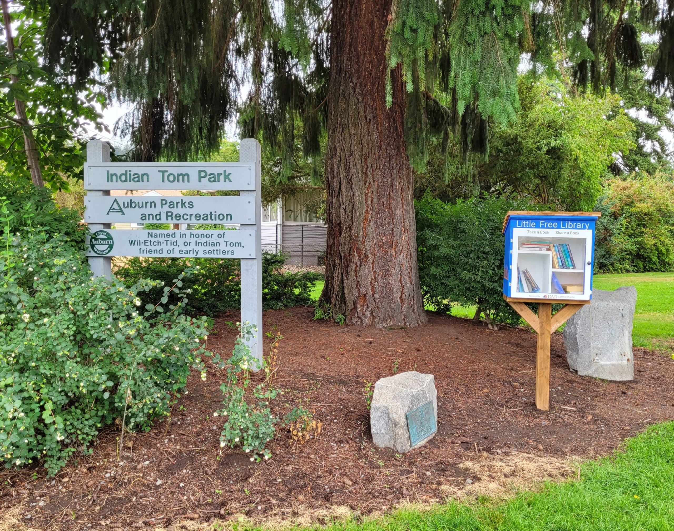 a little library near the Indian Tom Park sign