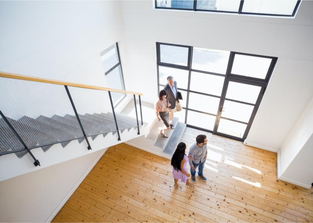 A realtor shows a couple a new home