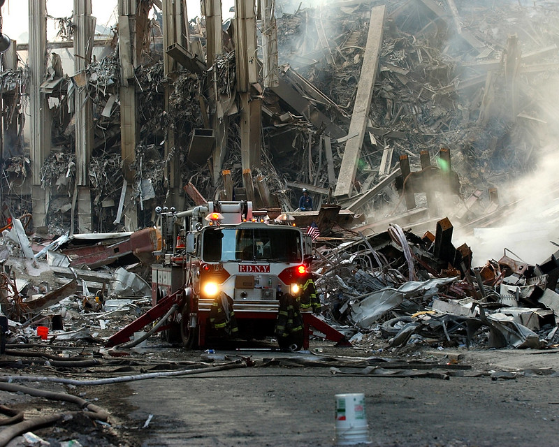 A lone fire engine at the crime scene in Manhattan where the World Trade Center collapsed following the Sept. 11 terrorist attack. Surrounding buildings were heavily damaged by the debris and massive force of the falling twin towers. Clean-up efforts are expected to continue for months. U.S. Navy