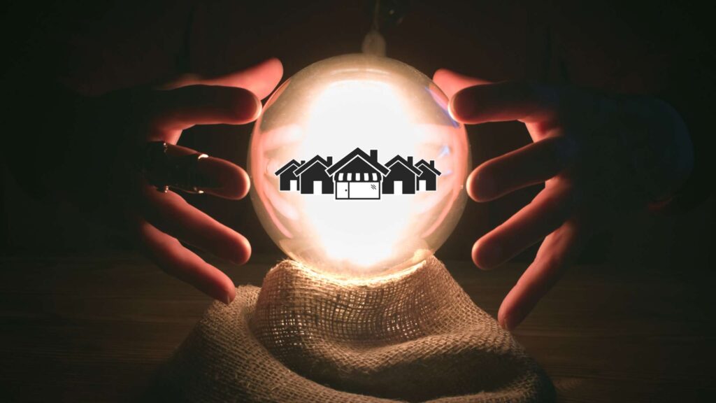 A hair of hands hover over a glowing crystal ball. Inside the crystal ball are 5 black houses