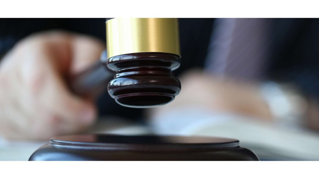 A judge's gavel in a downward motion