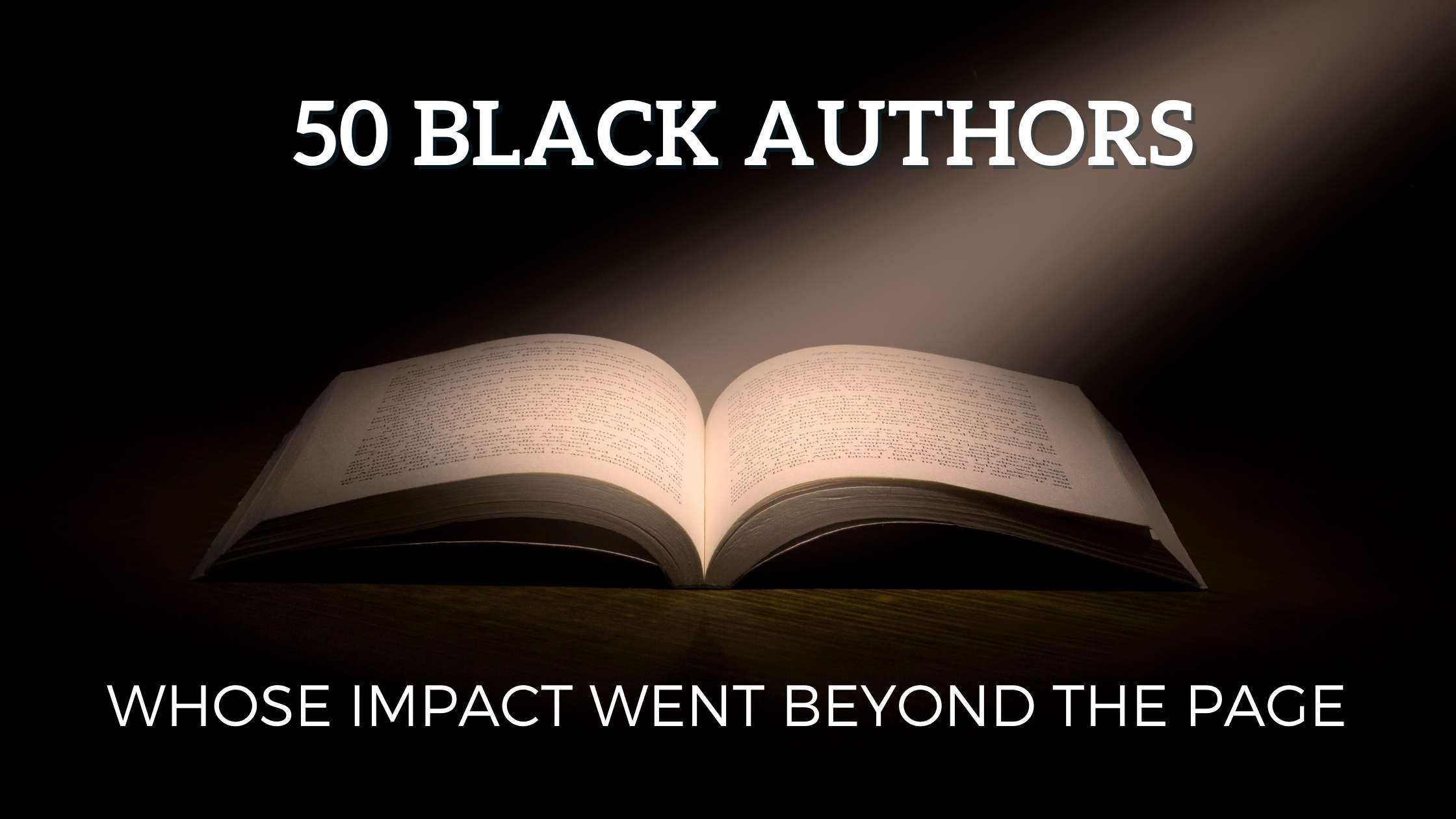 A book is opened with a light shining on its pages in a spotlight.