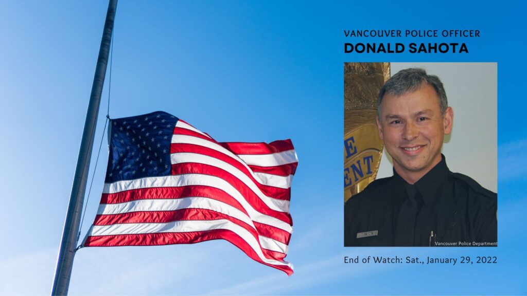 A US Flag at half staff, a photo of Officer Donald Sahota in uniform is overlay on the photo