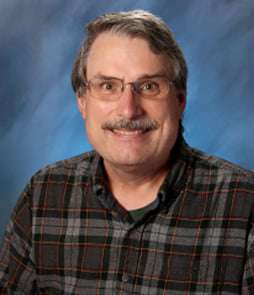 A school photo of Bernie Botz, an older white male with a mustache