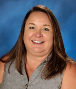 A standard yearbook photo of a female adult, Corrie Agnew