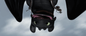 night fury from how to train your dragon looks at the camera upside down as they fly