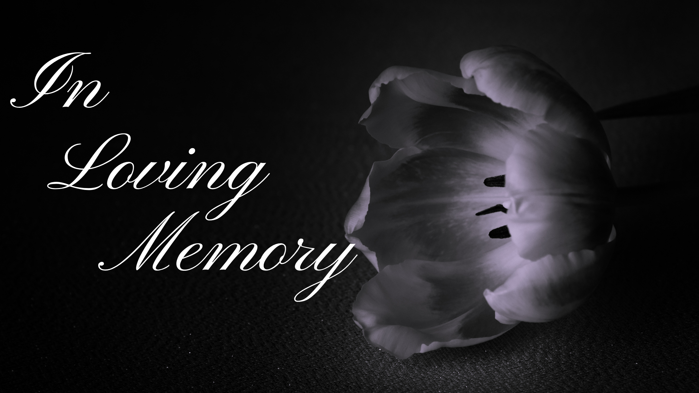 An open flower with the words "In Loving Memory" over it