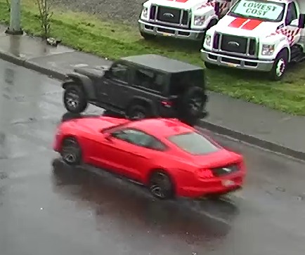 Still captured from footage of a ford mustang and jeep wrangler driving side by side