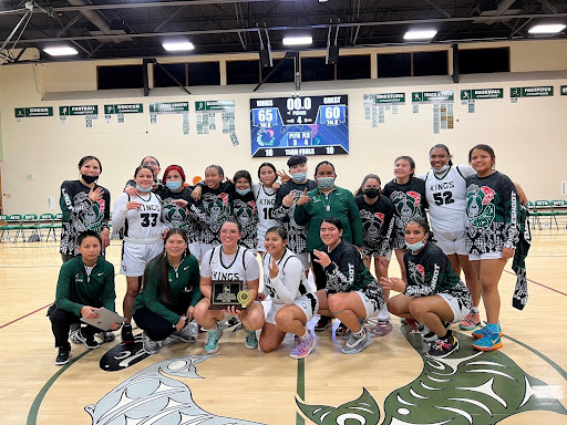 Muckleshoot Tribal School's girl's basketball team takes a team photo after winning in the 1B Sea-Tac League Tournament. PHOTO COURTESY OF RYAN GILMORE