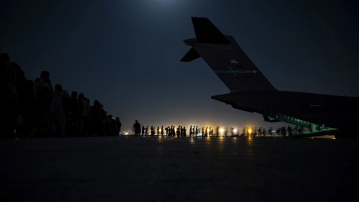 A U.S. Air Force aircrew evacuees boarding a U.S. Air Force C-17 Globemaster III aircraft in support of the Afghanistan evacuation 