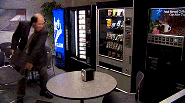 a gif of Kevin from the Office breaking into a vending machine