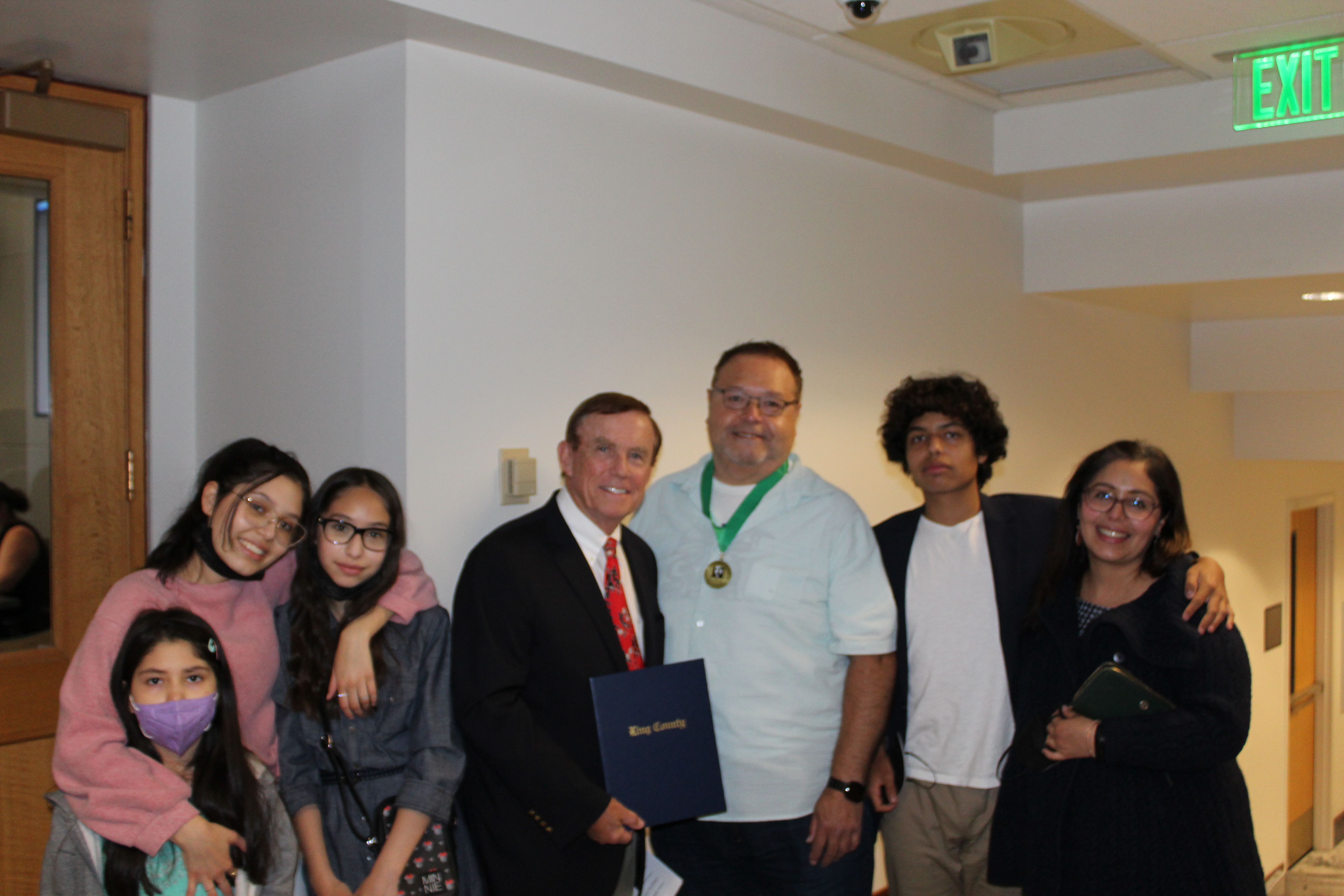 John Daniels Jr. and KC Councilmember Pete von Reichbuer with Daniel's family