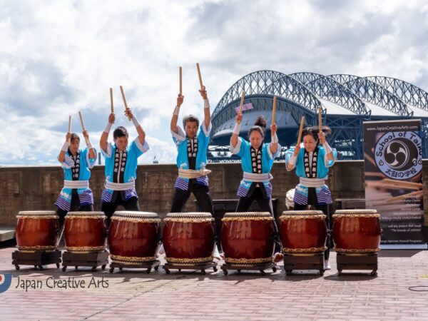 Drummers line up in front of drums