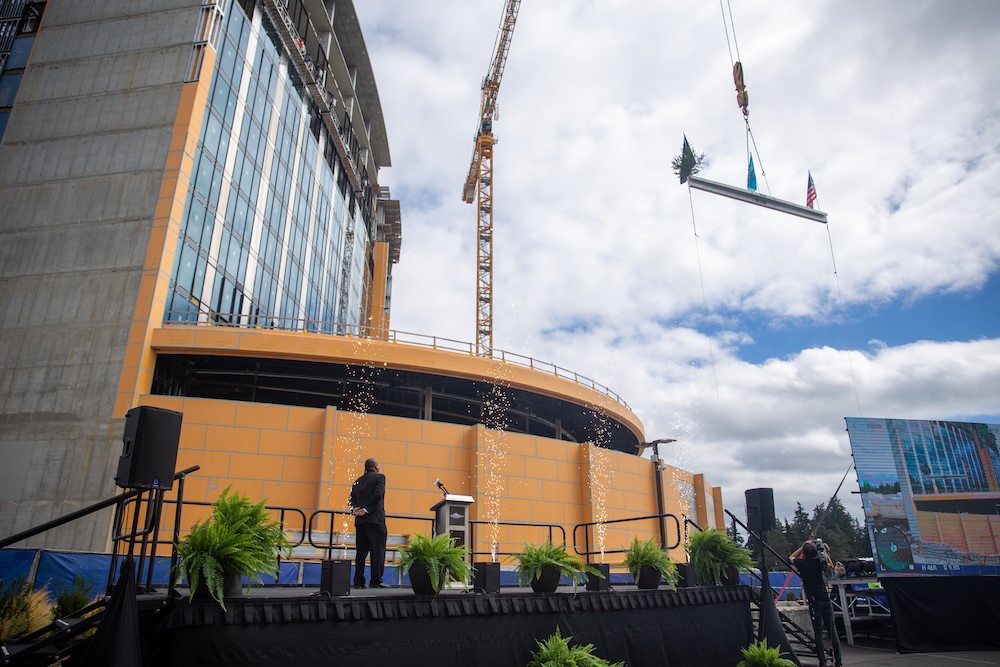 A crane lifts the final beam to the top of the Muckleshoot Casino & Resort
