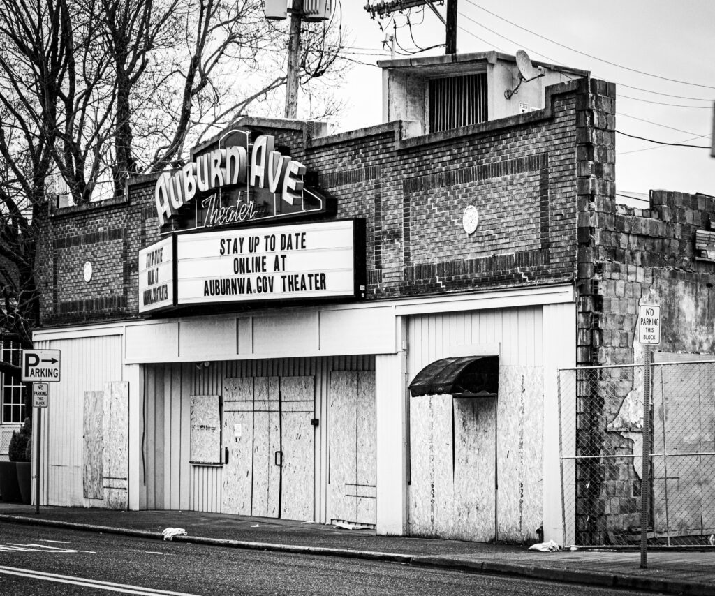 A Black and White Photo of the Auburn Avenue Theater boarded up after the Max House fire.