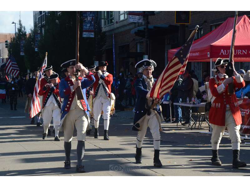 Military reenactment participants in the 2022 Auburn Veterans Parade.