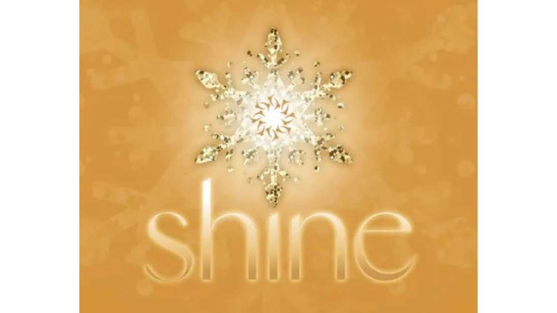 A gold toned image with "Shine" written under a a shimmering gold snowflake in the center.